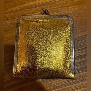 VNTG kiss lock makeup mirror gold foil design and a kiss-lock closure 1960’s